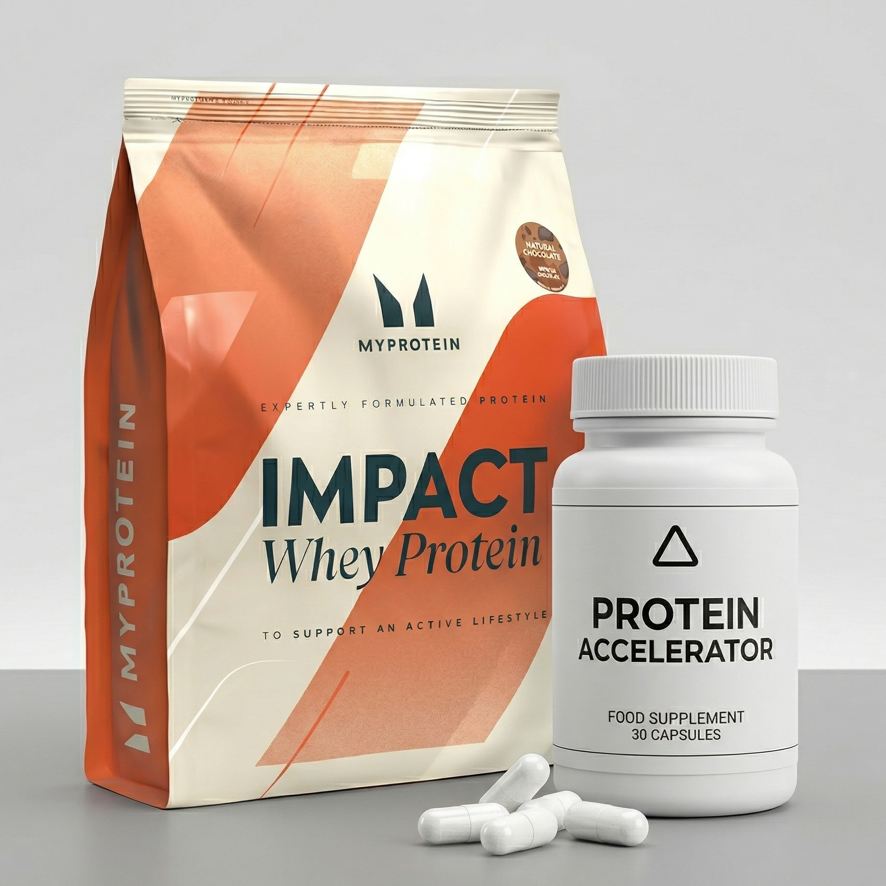 MyProtein Impact Whey Protein package and Protein Accelerator supplement on a gray background
